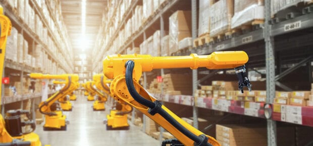 Yellow work robots on a warehouse floor