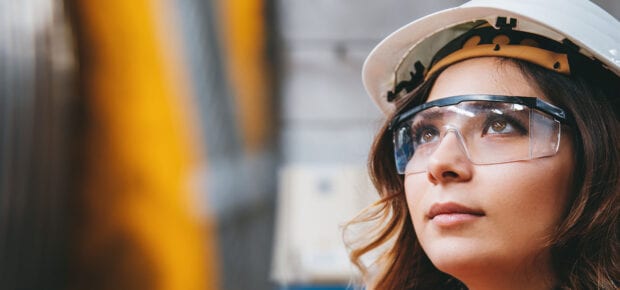 engineer woman wearing protective eyewear and hard hat