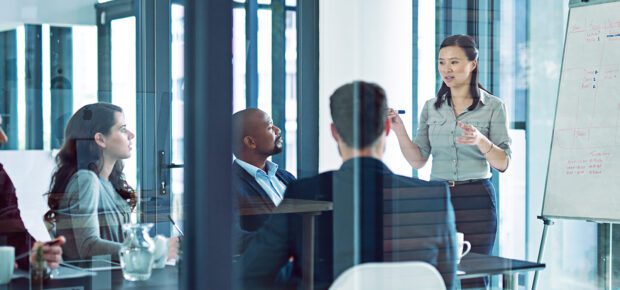 Shot of a businesswoman giving a presentation to coworkers in the boardroom